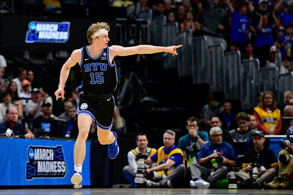 DENVER, COLORADO - MARCH 22: Richie Saunders #15 of the Brigham Young Cougars celebrates after a basket in the first half against the Wisconsin Badgers in the second round of the NCAA Men's Basketball Tournament at Ball Arena on March 22, 2025 in Denver, Colorado. (Photo by Dustin Bradford/Getty Images)